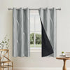 Elegant blackout curtains with a gray and black wave pattern hanging in a window.