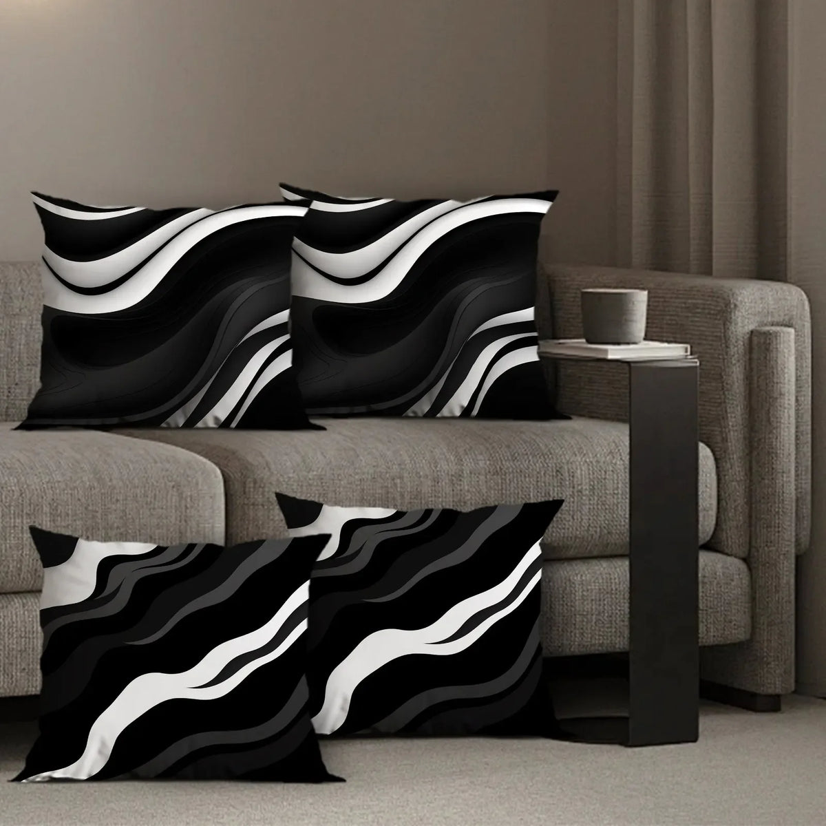 A set of black and white geometric pattern decorative pillowcases displayed on a sofa.