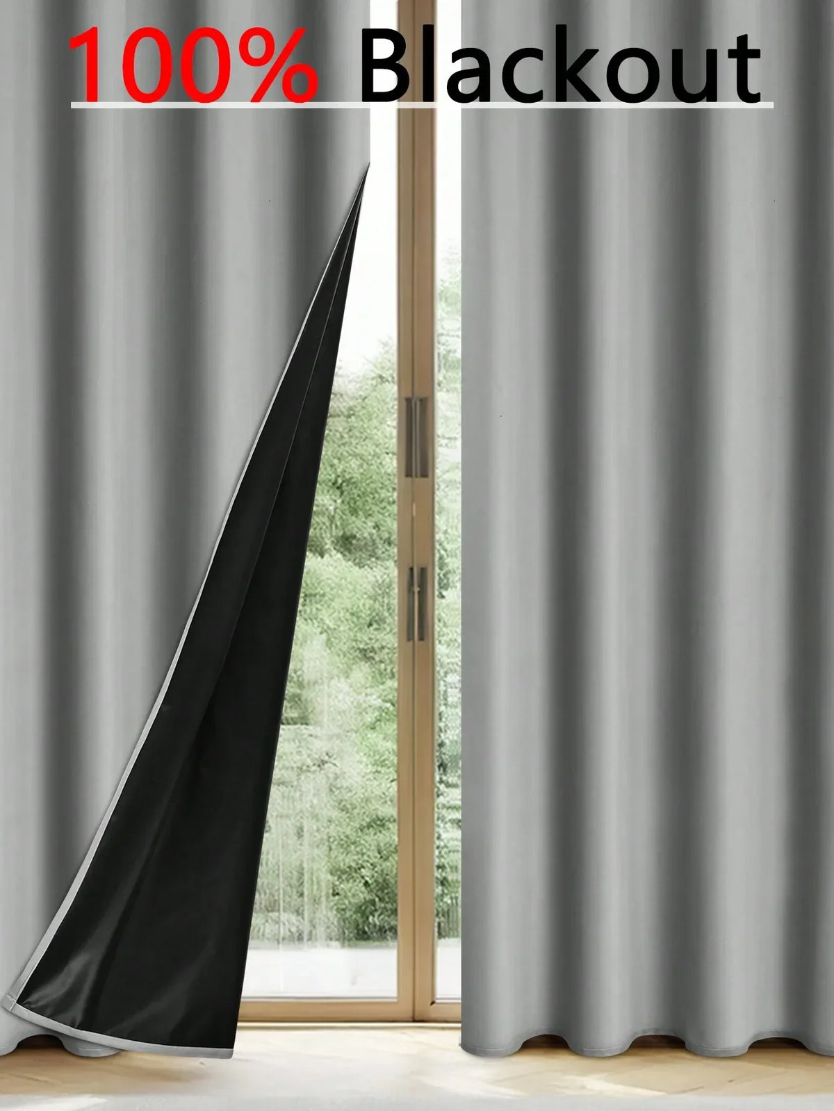 Solid black blackout privacy curtains hanging in a window frame.