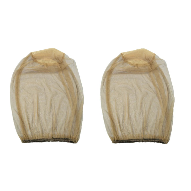 A pair of light tan mosquito protection fishing hats shown from the back.