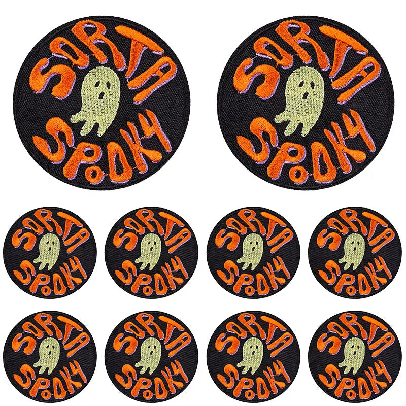 Set of eight black embroidery patches featuring a spooky ghost design in orange and yellow thread