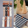 A set of eight handmade leather bag buttons in various shades of brown, black, and beige.
