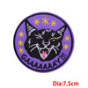 Purple embroidered patch featuring a black cat face with yellow stars and the text GAAAAAAAY!!!