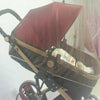 A foldable mosquito net canopy for an infant cot, shown in a brown and red color scheme.