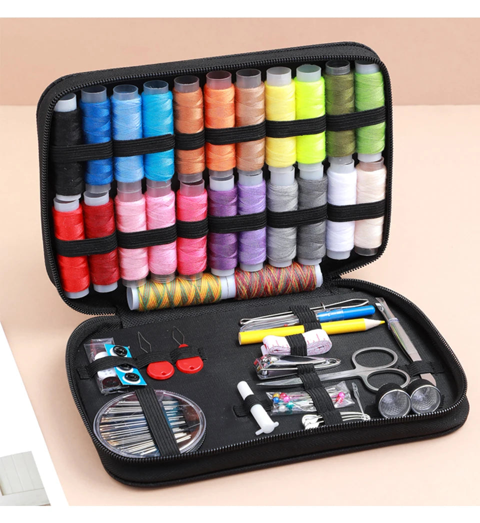 A black zippered pouch containing a complete sewing kit with various threads, needles, and tools for handicrafts.