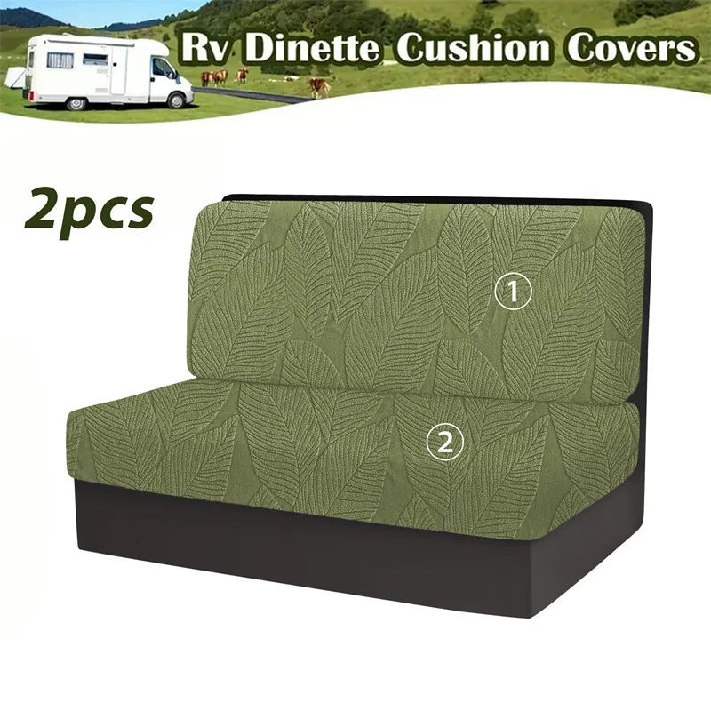 Two olive green cushion covers for an RV dinette with a leaf pattern.