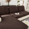 A dark brown jacquard knit sofa cushion cover is shown on a light-colored sofa.