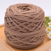 A ball of brown craft yarn made of 100% polyester for knitting and DIY projects.