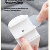 A hand is using a transparent invisible fixation strip to secure bed sheets and covers.
