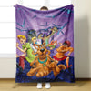 A purple flannel throw blanket featuring a cartoon illustration of Scooby-Doo and other characters.