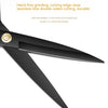 A close-up view of a black heavy duty industrial tailor scissor with a sharp cutting edge.