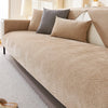 A beige chenille sofa cushion cover displayed on a light-colored sofa with neutral accent pillows.