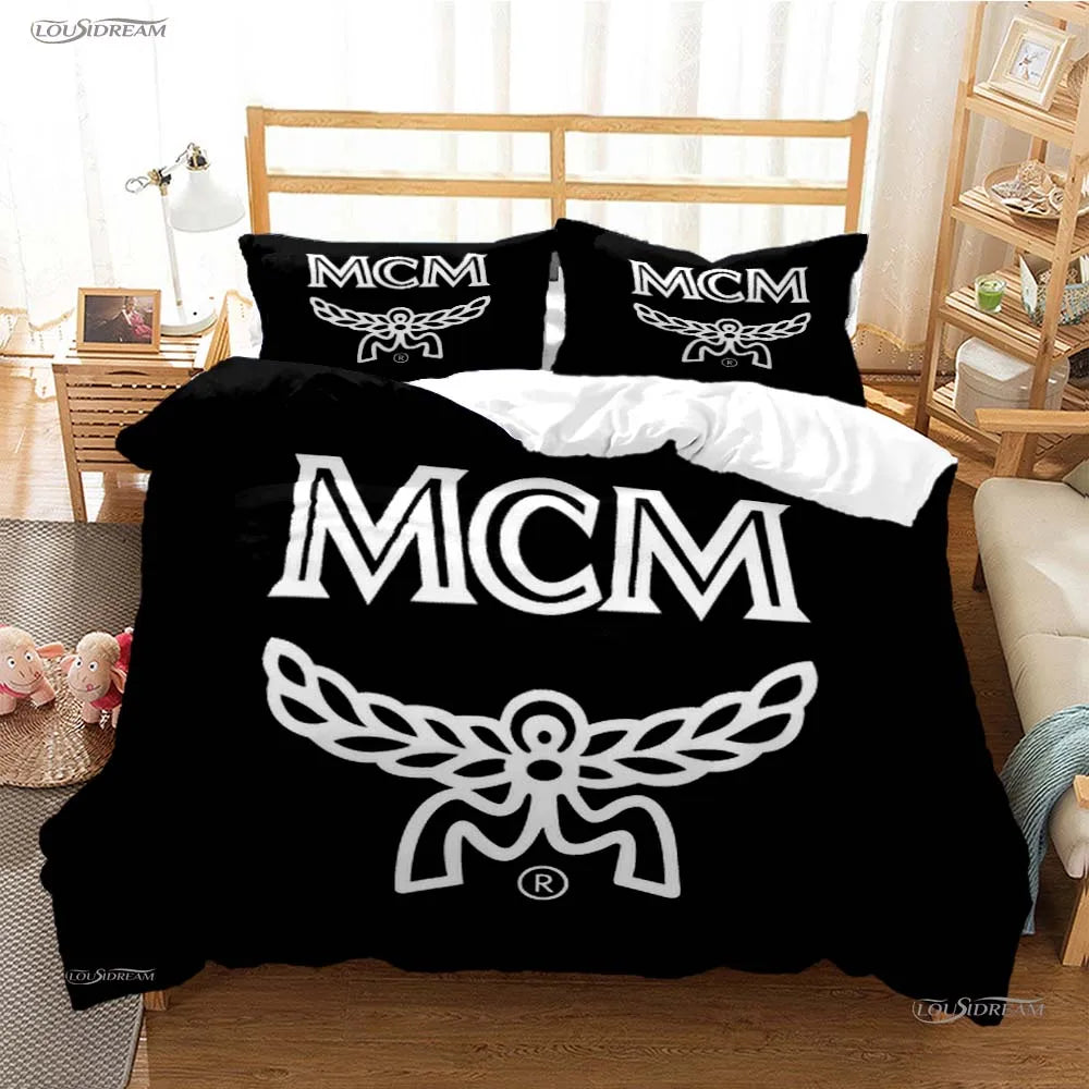 Black duvet cover featuring the MCM logo design on a bed.