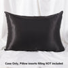 A black satin pillowcase is shown lying flat, ready for use.
