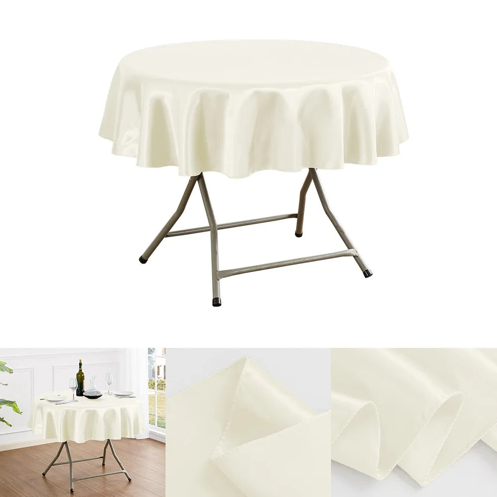A cream satin round table cloth draped over a metal pedestal table base.