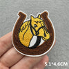 An embroidered patch featuring a yellow and black horse head design on a brown background.