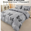 Gray butterfly print duvet cover set with two pillowcases displayed on a bed.
