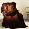 A dark fabric throw blanket featuring a circus theme illustration of a woman in red and gold attire.