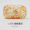 A ball of hand-dyed fabric strip yarn featuring an orange and white pattern for crochet and knitting.