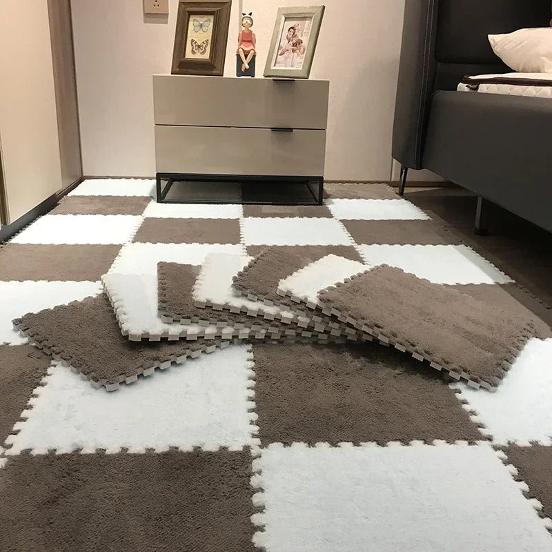 A square rug mat with a checkered pattern of gray and white plush interlocking puzzle pieces.