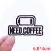 Black embroidered patch with the text NEED COFFEE and a rectangular outline.