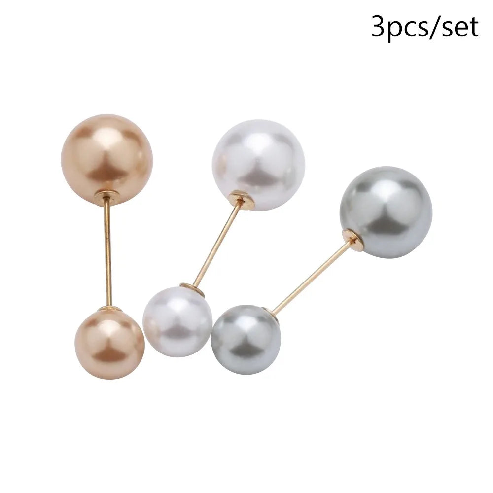 A set of three pearl-like round beads or components for jewelry making.