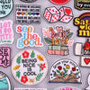 A collection of embroidered letter iron-on patches featuring various inspirational and cute designs.