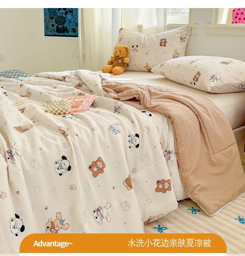 A light pink quilted blanket with a floral pattern is displayed on a bed, featuring cute animal designs.