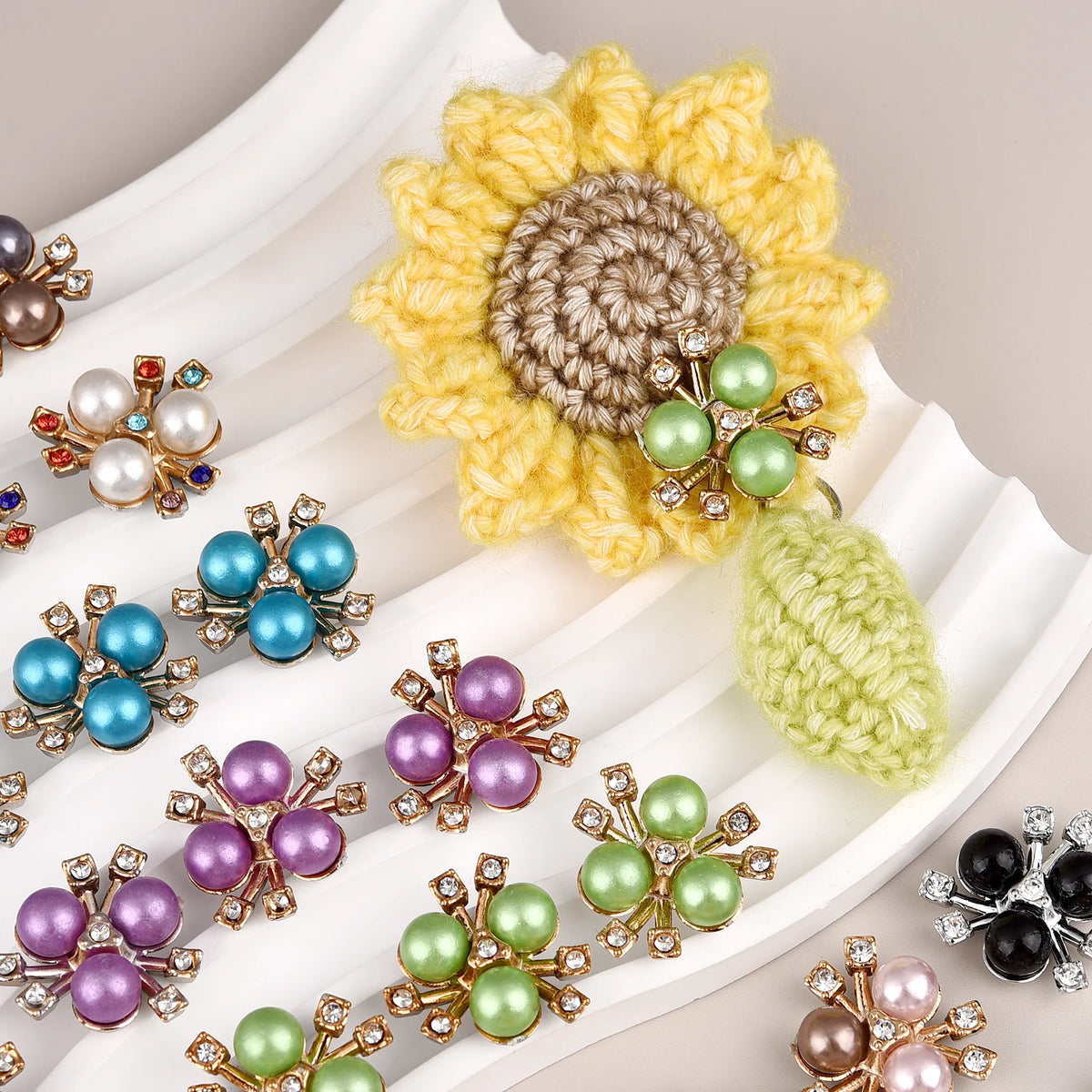 A collection of flower-shaped resin buttons adorned with various colored rhinestones and glitter.