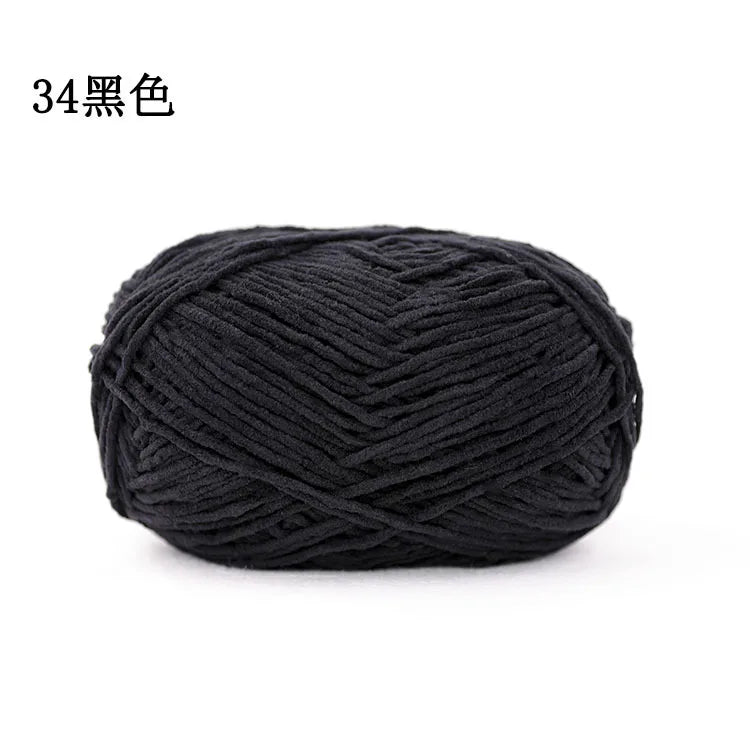 A ball of black 3mm matte chenille yarn for knitting and crochet.