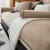 A close-up of a luxurious beige chenille sofa protector cover on a bed, featuring neutral tones and textured fabric.