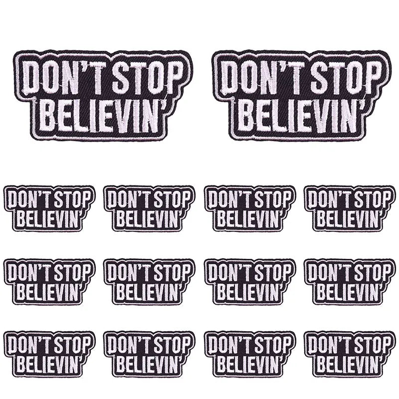 Black embroidered patches with the slogan Don't Stop Believin