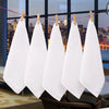 A set of ten white cotton face towels are hanging on a clothesline in a modern interior setting.