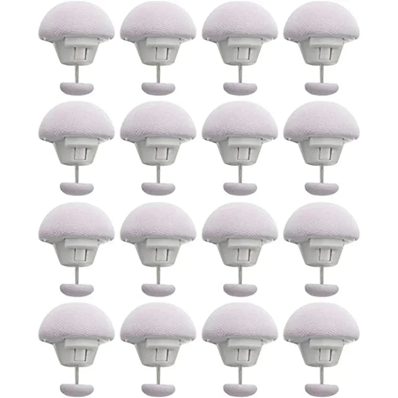 A set of white adjustable quilt and fabric clips shown from multiple angles.