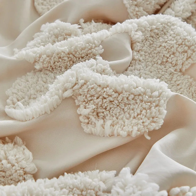 A close-up of a cream textured fabric, likely a duvet cover set, draped and folded.