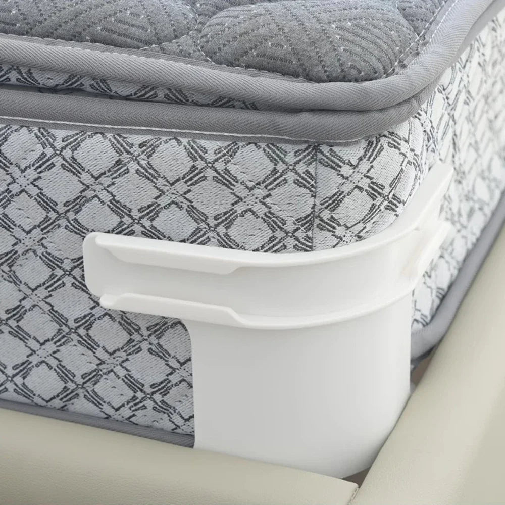 White corner tightener clips used to secure an invisible bedsheet on a mattress.