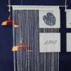 A white beaded string curtain hangs, featuring a heart design and the word LOVE.