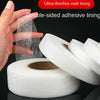 A hand is applying ultra-thin hot melt lining double-sided adhesive tape to a roll of white fabric tape.