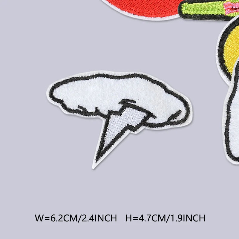 A white embroidered patch shaped like a lightning bolt on a light gray background.