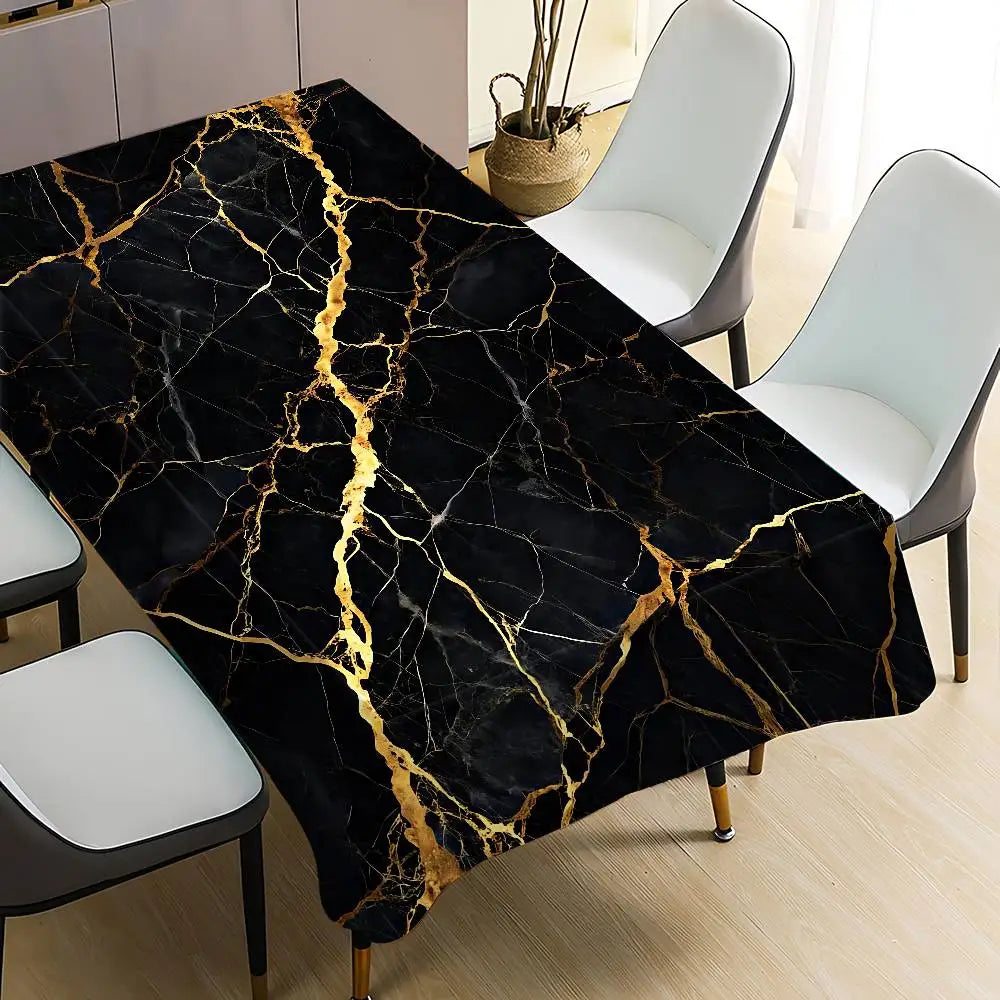Black marble pattern table cloth with gold veining displayed on a dining table.