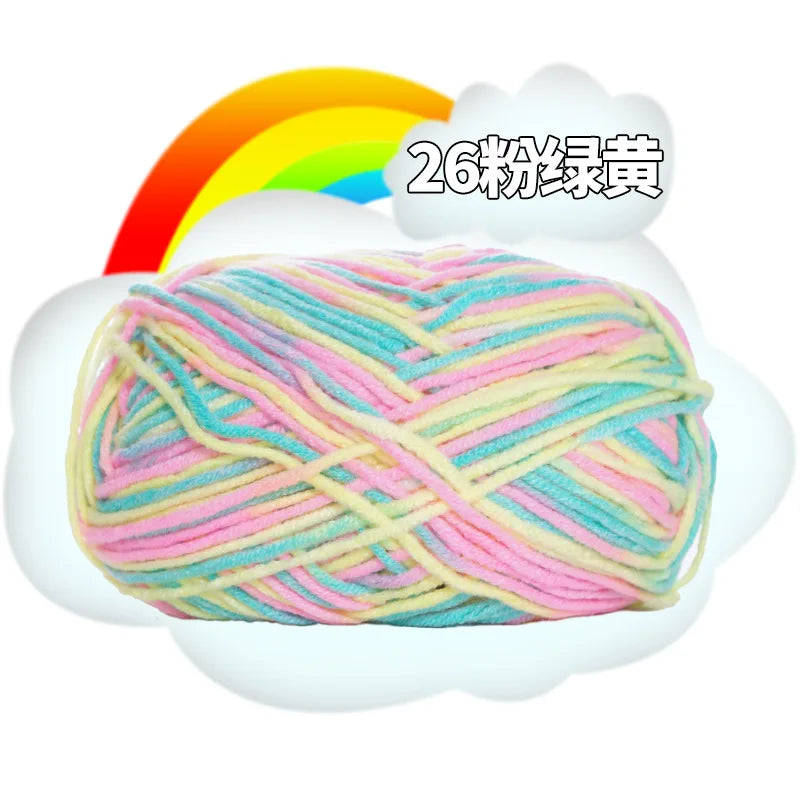 A ball of multi-colored yarn, featuring pink, blue, and yellow threads, is shown in a white cloud against a rainbow backgroun