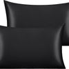 Two black silky satin toddler pillowcases stacked together.