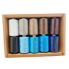 A box containing six spools of 10-color polyester sewing thread in various shades of beige, white, and blue.