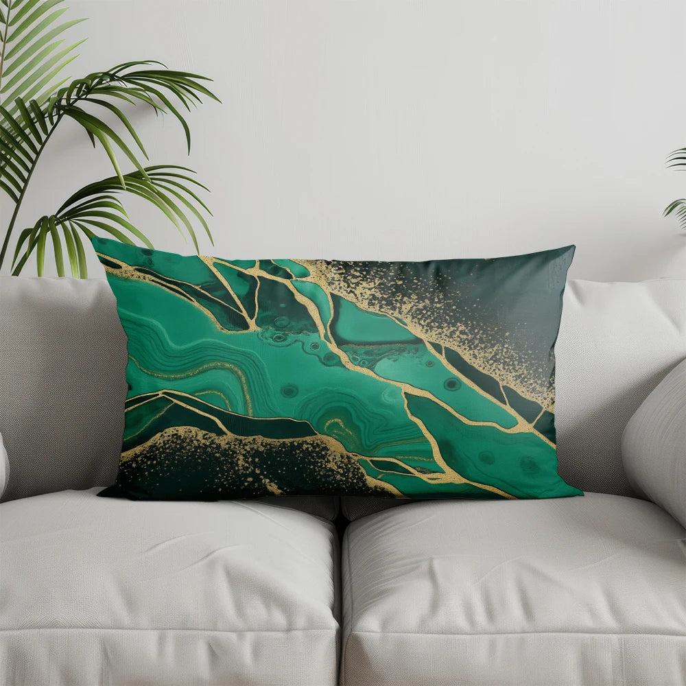 A square accent pillow cover featuring a marbled teal green and gold geometric pattern.