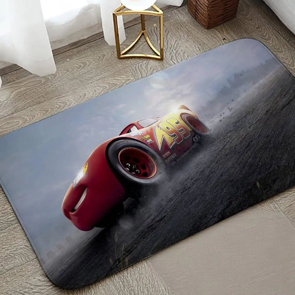 A cartoon red and yellow racing car is featured on a dark gray anti-slip door mat.