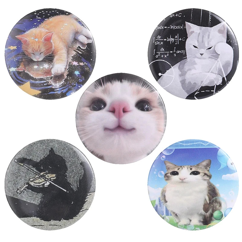 A set of tinplate pins featuring various animals like a kitten, a cat, and a black cat, with some music-themed designs.