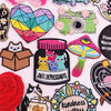 A collection of colorful cartoon cat embroidered iron-on patches featuring various expressions and designs.
