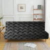 A dark gray woven velvet sofa cover displayed on a wooden frame against a white wall.