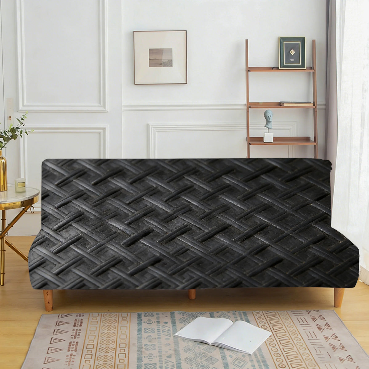 A dark gray woven velvet sofa cover displayed on a wooden frame against a white wall.