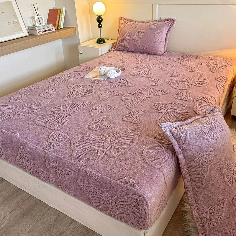 A lilac jacquard weave fitted sheet bedding set on a light wood bed frame with a bedside lamp.